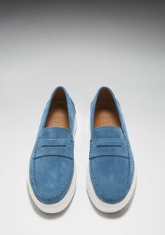 Ultra relaxed slip on sneaker loafer shoes for men by Hugs & Co. in petrol blue suede with a crisp white sneaker sole from Vibram. Featuring our signature full leather lining for absolute comfort. Hand stitching processes finish the contemporary take on a classic Hugs & Co. loafer style. UK Sizing Made in Portugal 100% Suede Upper featuring a 100% Leather Lining Sneaker sole Casual Blue Slip-on Loafers, Blue Slip-on Loafers With Contrast Sole, Blue Slip-on Formal Loafers, Blue Loafers With Contrast Sole Slip-on, Blue Shoes Men, Luxury Blue Men's Slip-on Shoes, Loafer Shoes For Men, Blue Loafers, Knitting Cardigan