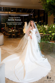 a woman in a wedding dress posing for a photo