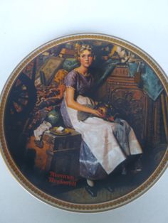 a plate with a woman sitting on top of it