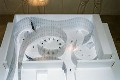 an architectural model of a building with white walls and floors