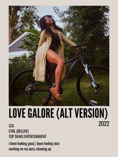 a woman sitting on top of a bike in front of a house with the caption love galore at version 2012