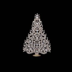 a crystal christmas tree is shown against a black background