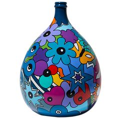 a blue vase with colorful flowers painted on the side and stars, fish, and shapes