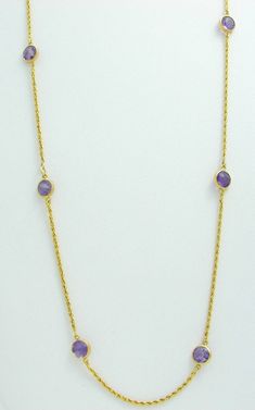 This 14k yellow gold amethyst necklace is pre owned but it’s in  BRAND NEW CONDITION. The necklace has 8 round bezel set NATURAL purple amethyst gemstones. The bezels average 9.0 mm in diameter. The amethyst average 6.0 mm in diameter, they weigh approx. 5.60 carats total weight. The necklace measures 19 1/2” long and it weighs 6.5 grams. Any dark or light areas you see on any of the stones are reflections from my camera.  Please look at my FEEDBACK for CREDIBILITY and BIDDING CONFIDENCE. Amethyst Necklace, Fine Jewellery Necklace, Amethyst Gemstone, Purple Amethyst, Bezel Setting, Jewelry Necklace Pendant, Jewelry Watches, Amethyst, Fine Jewelry