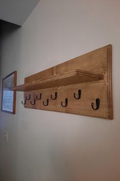 there is a coat rack with hooks on it