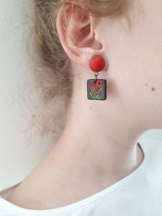 Red poppies earrings, Clay earrings, red and black dangle polymer clay earrings, Statement earrings FEDEX priority shipping takes: 2-3 WORKDAYS ( USA ). These are unique, handmade, polymer clay earrings with spring poppies motifs. These beautiful earrings are pieces of original and unique artwork. The method is known as 'appliqued technique'. Using tiny pieces of clays and a sharp needle. I don't use molds to prepare my jewelry. Each small parts of the motifs are made by hand and placed one by o Red Polymer Clay Flower Earrings For Gift, Red Drop Earrings In Polymer Clay, Poppy Polymer Clay, Red And Black Polymer Clay Earrings, Red Flower-shaped Polymer Clay Jewelry, Colorful Earrings, Tiny Flowers, Red Poppies, Gifts Photos