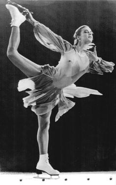 a black and white photo of a woman doing ballet