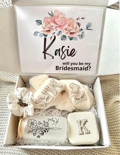 the bridesmaid gift box is filled with personalized items for her special day