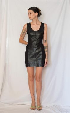 1990s Black Leather Mini Dress Made in France High quality soft leather  Other fabric on the side Back zipper Amazing quality and fit Love the combination of leather and the other fabric, so cool Best shape and length Excellent condition Fits : S but check the measurements  (model wearing XS, pinned when its more fitted) Material : 100% Real Leather and the other fabric is polyamide & lycra  In garment laying flat Bust 44 cm Waist 37 cm Total length 80 cm Mini Length Leather Dress, Black Leather Mini Dress, Leather Mini Dress Lace Up, Knee-length Leather Mini Dress For Night Out, Leather Knee-length Evening Mini Dress, Sleek Black Leather Mini Dress, Black Leather Fabric, Leather Mini Dress, Style Expert