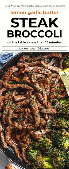 steak and broccoli in a skillet with lemon wedges on the side