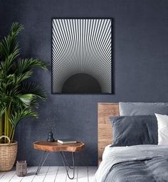 a bedroom with a bed, plant and painting on the wall above it that is black and white