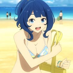 a woman with blue hair is standing on the beach