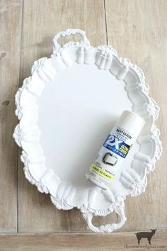 a white plate with a spray bottle on it