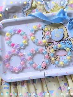 there is a tray that has some decorations on it and stars in the background,