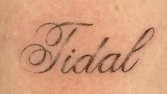 a close up of a tattoo with the word bride written on it