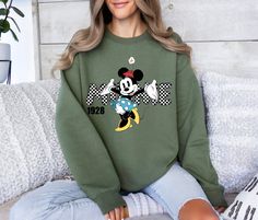 Cute Minnie 1928 Sweatshirt - Minnie Mouse Hoodie - Minnie Mouse Lovers Sweater - Gift For Minnie Lovers - Mickey Mouse Sweatshirt Description How can I order? 1️) Please review all the information provided before placing an order 2️) Select the shirt type and size. 3️) Select the color of the shirt using the following options. 4️) Need more Items? Add the current item in the cart. And If you like to add more items to your order please press the back button and repeat steps 1-4 again. 5️) Once a Cute Minnie Mouse Crew Neck Sweatshirt, Winter Cotton Minnie Mouse Sweatshirt, Minnie Mouse Hoodie, Minnie Mouse Sweatshirt, Black T-shirt With Minnie Mouse Graphic, Crew Neck, Disney Minnie Mouse Crew Neck T-shirt, Mickey Mouse Sweatshirt, Sweater Gift, Types Of Shirts