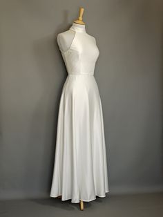 a white dress on a mannequin dummy