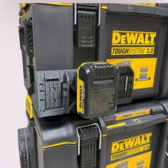 several dew tools are stacked on top of each other in black and yellow boxes,