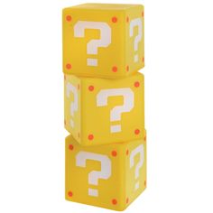 three yellow dices with question marks on them are stacked up in the shape of cubes