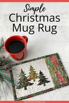 a cup of coffee sitting on top of a table next to a christmas mug rug