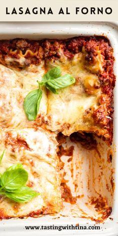 lasagna al forno with basil leaves on top in a white casserole dish