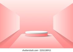 an empty pink room with a round object on the floor and light coming from it