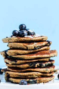 a stack of pancakes with blueberries on top