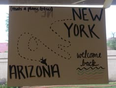 a sign that says new york, welcome to arizona and there is a map on it