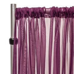 purple sheer curtains hanging from a metal pole