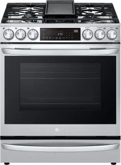 a silver stove top oven sitting on top of a white countertop kitchen appliance