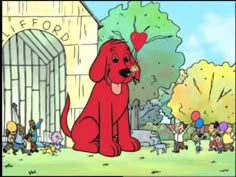 a red dog sitting in front of a crowd of people