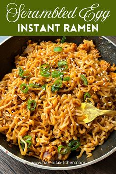 instant ramen in a skillet with green onions and sesame seeds on the side