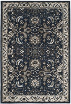 a blue and beige rug with an ornate design on the bottom, in front of a white background