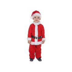 a little boy dressed in a santa suit and standing on one leg with his hands in his pockets