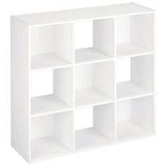 a white shelf unit with six compartments