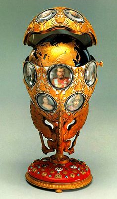 an ornately decorated vase with pictures on it