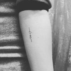 a woman's arm with the word love tattooed on her left side ribcage