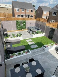 an aerial view of a backyard with grass and seating