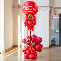 a valentine's day decoration with balloons and teddy bears