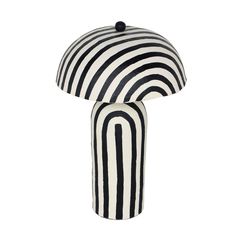 a black and white striped table lamp on a white background