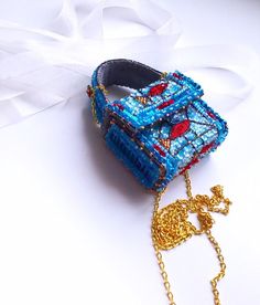 "Little handbag for coins or face mask. Made with the inspiration of glass wall art.  All material are used to show \"glass\" effect.  *Dimensions 5,5x7x2 cm *Chain 1,35 m *Handbag closes with magnets * Inside is  made from wild silk No returns Color on photo and life  can change a bit, due to monitor specification Do not accept orders from Canada, Australia and Germany (from 0.1.07.2022).  Shipping from Latvia to Europe usually takes 3-10 days, USA 20-30 days.  Thank you for your visit!" Small Handmade Bags For Daily Use, Handmade Pouch Shoulder Bag As Fashion Accessory, Handmade Pouch Shoulder Bag For Fashion, Mobile Phone Clutch Pouch, Square Portable Pouch As Gift, Portable Square Pouch For Gifts, Square Portable Pouch For Gift, Blue Crossbody Bag As Gift, Square Gift Pouch