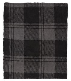 a black and grey plaid blanket on a white background