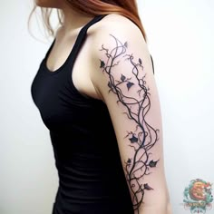 a woman with a tattoo on her arm