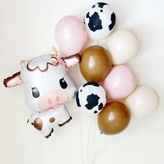 Cute cow balloon bouquets in blush pinks, dusty rose, beige, brown and cow print Brown Cow Party Decorations, Farm Balloon Bouquet, Pink Cow Print Baby Shower Ideas Girl, One Birthday Balloons, Barnyard Themed Birthday Party, Pink And Cow Print, Baby Shower Balloons Girl, Cow Print Balloons, Cow Balloons