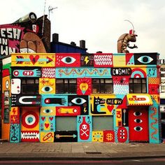 a multi - colored building with lots of windows and decorations on the side of it