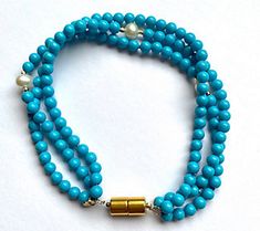 Luxurious strands of reconstituted turquoise beads and cultured freshwater pearl accents give this stunning bracelet some major under-the-sea vibes. From Alkeme. Turquoise Beads, Fresh Water, Freshwater Pearls, Jewelry Bracelets, Beaded Necklace, Beaded Bracelets, Turquoise, Beads