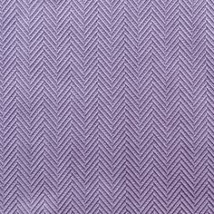 a close up view of a purple cloth textured with herringbones and lines