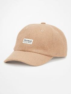 a tan hat with the word stuour on it, sitting against a white background