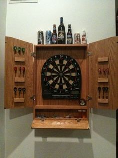 a dart board mounted to the side of a cabinet