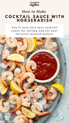 a plate with shrimp, lemons and sauce on it